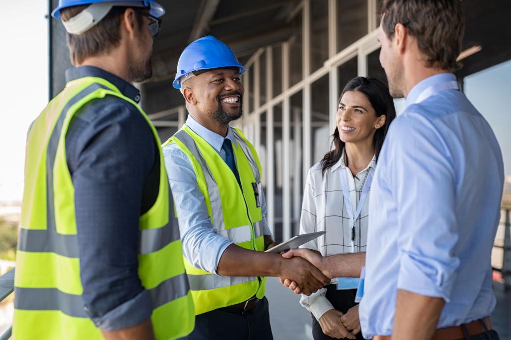 construction workers shaking hands