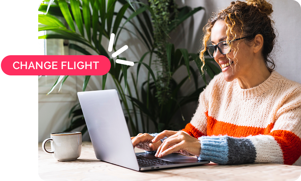 Woman on laptop with text overlay that says Change Flight